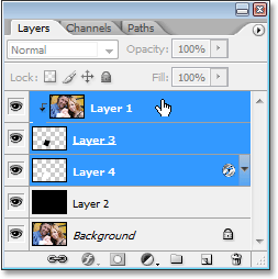 Selecting the three top layers in the Layers palette at once.