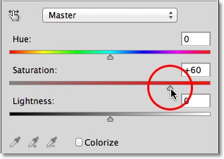 Dragging the Saturation slider for the Hue/Saturation adjustment layer.