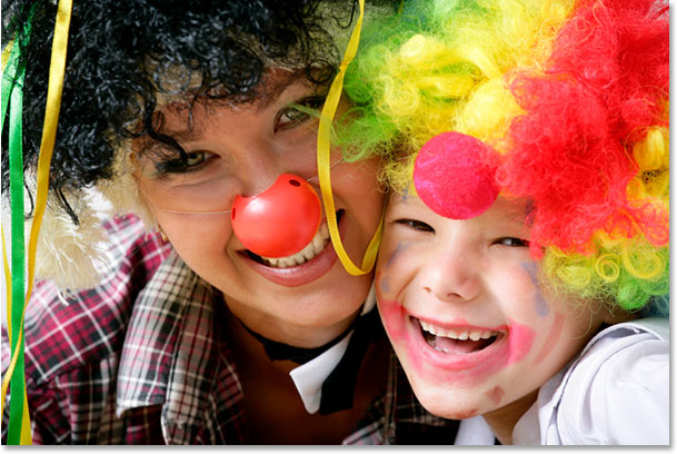 A photo of a mother and son dresses as clowns.