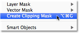 Choosing the Create Clipping Mask command from the Layer menu in Photoshop.