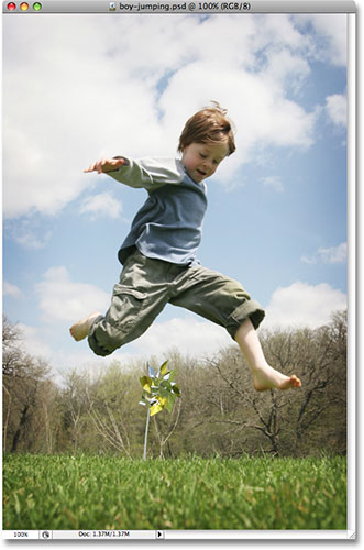 A young boy jumping outdoors. Image licensed from iStockphoto.com by Photoshop Essentials.com.