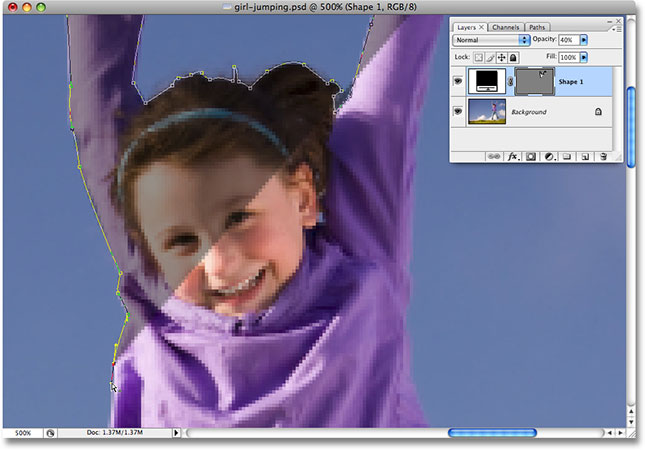 Drawing a shape outline around the girl with the Pen Tool. Image licensed from iStockphoto.com by Photoshop Essentials.com.