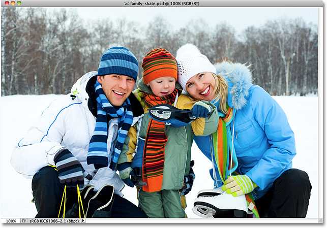 A family with ice skates smiling. Image licensed from Shutterstock by Photoshop Essentials.com.