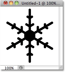 Dragging out a snowflake shape in Photoshop.