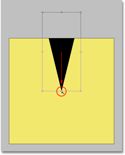 Dragging the center rotation point of the Free Transform command in Photoshop. Image © 2008 Photoshop Essentials.com.