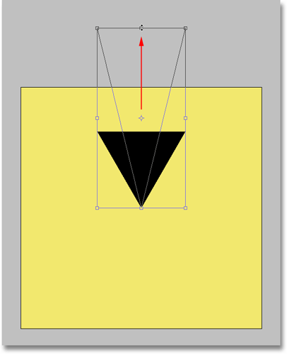 Stretching the triangle up beyond the top of the canvas with the Free Transform command in Photoshop. Image © 2008 Photoshop Essentials.com.