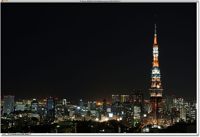 A photo of a city at night. Image licensed by Photoshop Essentials.com