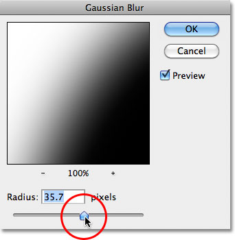 Dragging the Radius slider in the Gaussian Blur filter dialog box in Photoshop.