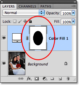 The layer mask thumbnail now shows the black-filled elliptical shape.