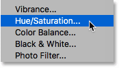 Adding a Hue/Saturation adjustment layer to the fire text effect