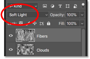 Blending the fibers texture into the flames by changing its blend mode to Soft Light