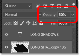 Lowering the shadow's opacity to 50 percent in Photoshop's Layers panel