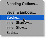 Choosing Stroke from the list of layer effects in Photoshop's Layers panel