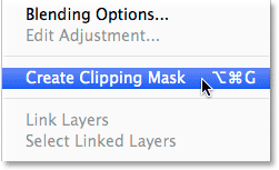 Selecting Create Clipping Mask from the Layers panel menu.