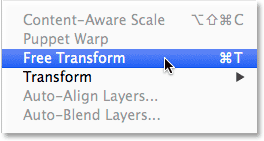 Selecting the Free Transform command from the Edit menu in Photoshop.