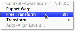 Choosing the Free Transform command from the Edit menu in Photoshop. Image © 2011 Photoshop Essentials.com.